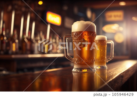 A glass of beer on the bar. Delicious beer. Bar in the background. 105946429