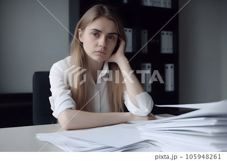 Tired young woman at her workplace in the office. Overwork and burnout concept. AI generated. 105948261