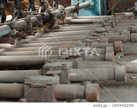 Details of machines and units. Details and fragments of Metalworking machines in an abandoned factory, close-up. Details of machines and units. Details and fragments of Metalworking machines in an abandoned factory, close-up. 105948299