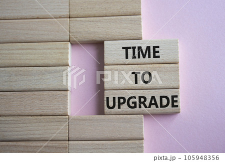 Time to Upgrade symbol. Concept words Time to Upgrade on wooden blocks. Beautiful pink background. Business and Time to Upgrade concept. Copy space. Time to Upgrade symbol. Concept words Time to Upgrade on wooden blocks. Beautiful pink background. Business and Time to Upgrade concept. Copy space. 105948356