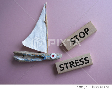 Stop Stress symbol. Concept word Stop Stress on wooden blocks. Beautiful pink background. Business and Stop Stress concept. Copy space 105948478