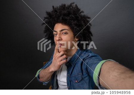 Young handsome smiling guy making selfie and looking flirty 105948956