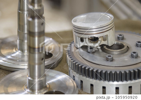 Close up scene the aluminum piston and clutch set parts. Close up scene the aluminum piston and clutch set parts. 105950920