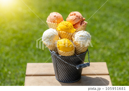 Assorted ice cream flavours in delightful waffle cones Assorted ice cream flavours in delightful waffle cones 105951681
