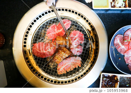 roast pork , barbecued pork or barbecued beef or grilled beef and grilled pork in stove roast pork , barbecued pork or barbecued beef or grilled beef and grilled pork in stove 105953968