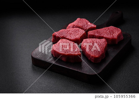 Juicy fresh raw beef meat with salt, spices and herbs 105955366
