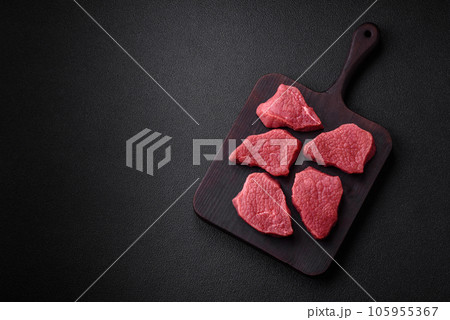 Juicy fresh raw beef meat with salt, spices and herbs 105955367