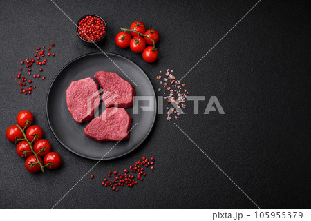 Juicy fresh raw beef meat with salt, spices and herbs Juicy fresh raw beef meat with salt, spices and herbs 105955379