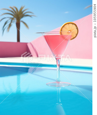 Pink cocktail with lemon wedge sitting on the pool table 105955904