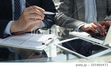 close up. the businessman looks at the financial report close up. the businessman looks at the financial report 105960471