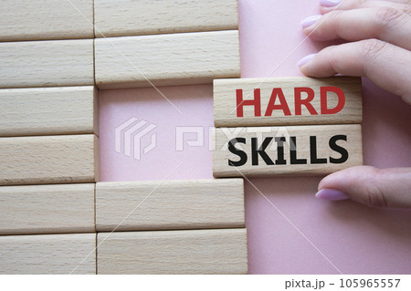 Hard skills symbol. Wooden blocks with words Hard skills. Beautiful pink background. Businessman hand. Business and Hard skills concept. Copy space. Hard skills symbol. Wooden blocks with words Hard skills. Beautiful pink background. Businessman hand. Business and Hard skills concept. Copy space. 105965557