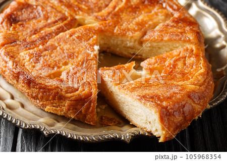 Kouign amann French pastries of Brittany region closeup on the plate. Horizontal Kouign amann French pastries of Brittany region closeup on the plate. Horizontal 105968354