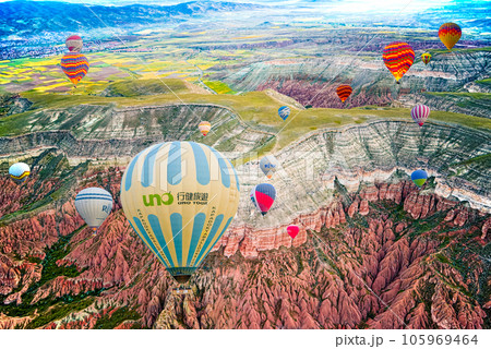 Cappadocia, Turkiye - July 07, 2023-Air balloons in Cappadocia-unreal views in valley. 105969464