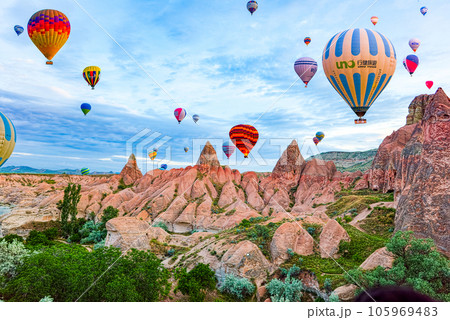 Cappadocia, Turkiye - July 07, 2023-Air balloons in Cappadocia-unreal views in valley. 105969483