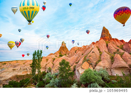 Cappadocia, Turkiye - July 07, 2023-Air balloons in Cappadocia-unreal views in valley. 105969495
