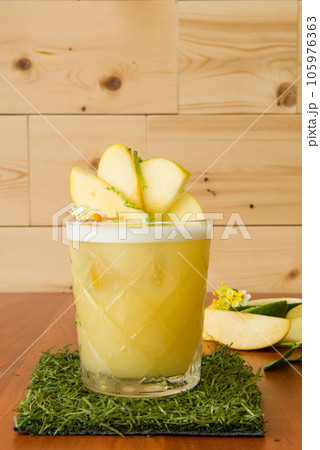 delicious cocktail or refreshing mix served and decorated by a bartender delicious cocktail or refreshing mix served and decorated by a bartender 105976363