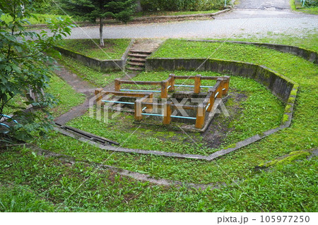 Banja Koviljaca, Loznica, Serbia. Mount Guchevo, park and forest. Source of mineral sulfuric and ferruginous water Rakina Chesma Cesma. A spring near the road to Guchevo. Concrete fence and stairs 105977250
