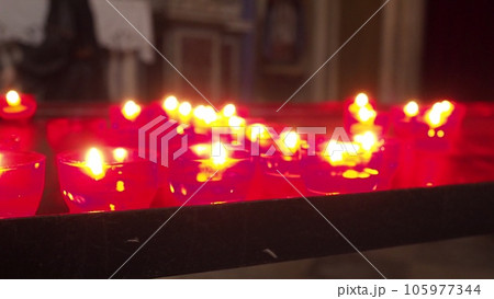 Memorial Day with candle. Commemorative candles are lit. Candle flames burn in the cemetery. Burning candles in the catholic church in Dubrovnik Croatia. Lots of candles. The flame sways in the draft Memorial Day with candle. Commemorative candles are lit. Candle flames burn in the cemetery. Burning candles in the catholic church in Dubrovnik Croatia. Lots of candles. The flame sways in the draft 105977344