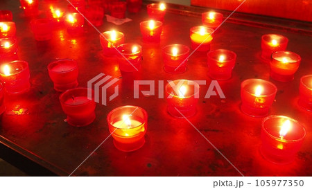 Memorial Day with candle. Commemorative candles are lit. Candle flames burn in the cemetery. Burning candles in the catholic church in Dubrovnik Croatia. Lots of candles. The flame sways in the draft Memorial Day with candle. Commemorative candles are lit. Candle flames burn in the cemetery. Burning candles in the catholic church in Dubrovnik Croatia. Lots of candles. The flame sways in the draft 105977350