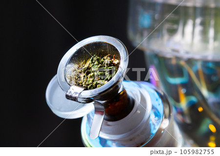 Macro close up smoking medical marijuana bud with bong Macro close up smoking medical marijuana bud with bong 105982755