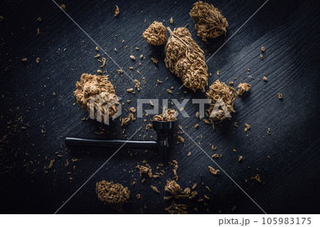 Dry CBD cannabis with metal smoking pipe 105983175