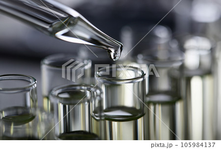 Yellow liquid spilled petrol additive innovative supply 105984137