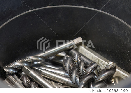Close up scene  the used machine tapping tool. Close up scene  the used machine tapping tool. 105984190