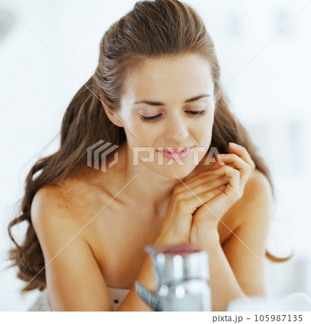 relaxed young woman in bathroom relaxed young woman in bathroom 105987135