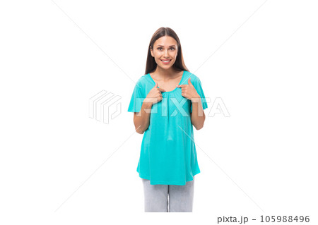 portrait of a pretty young caucasian brunette woman with long hair in a blue t-shirt on a white portrait of a pretty young caucasian brunette woman with long hair in a blue t-shirt on a white 105988496