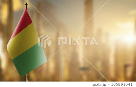 Small flags of the Guinea on an abstract blurry background 105991041