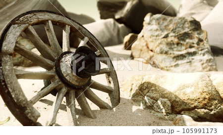 old tradition waggon wheel on the sand 105991173