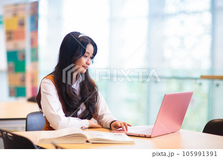 Asian girl in school. Student in classroom. 105991391