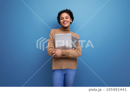 isolated background, cute young brunette hispanic woman freelancer holding laptop isolated background, cute young brunette hispanic woman freelancer holding laptop 105991441