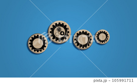 Wooden dice with cogwheel on blue background, mutual aid concept 105991711
