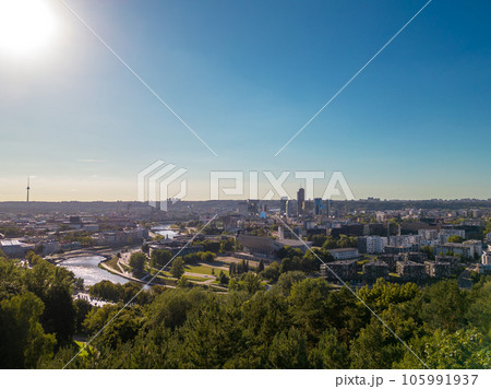 View of Vilnius city, skyscrapers, modern downtown, and a sunny evening View of Vilnius city, skyscrapers, modern downtown, and a sunny evening 105991937