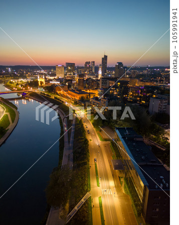 Night view of lit-up downtown Vilnius with skyscrapers. Vertical shot 105991941