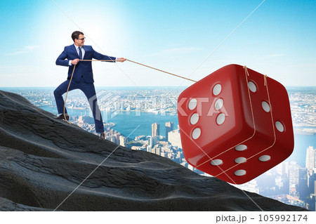 Uncertainty concept with businessman and dice 105992174