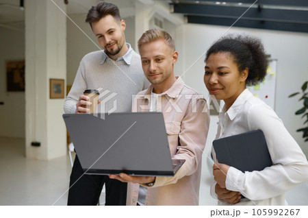 Friendly male colleague explaining how easy correct mistake to happy woman 105992267