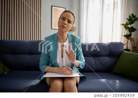 Military psychologist talking to patient looking at camera as webcam 105992439
