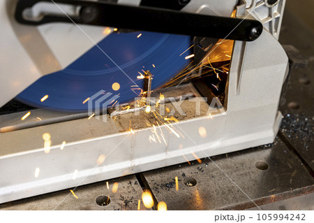 metal saw with tool cutting disc makes a cut metal saw with tool cutting disc makes a cut 105994242