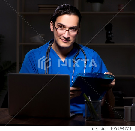 Young male doctor in the hospital at night 105994771