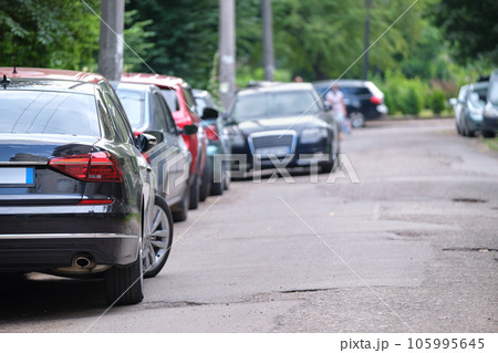 Cars parked in line on city street side. Urban traffic concept 105995645