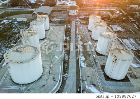 Aerial view of big fuel reservoires in petrol industrial zone in winter. Aerial view of big fuel reservoires in petrol industrial zone in winter. 105997627