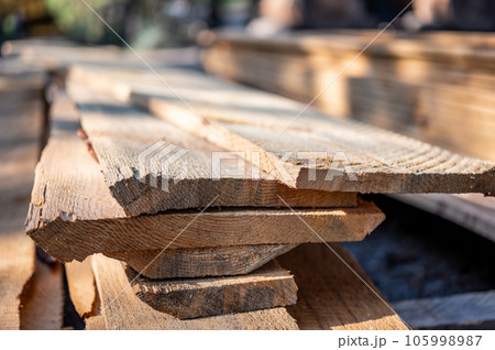 Selective focus on staked rough cut lumber at a saw mill Selective focus on staked rough cut lumber at a saw mill 105998987