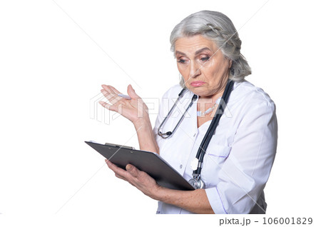 senior female doctor with folder on white background 106001829