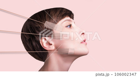 Kinesiotaping. Young woman with tape on her face. Physiotherapy and cosmetology procedure. 106002347