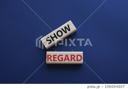Show regard symbol. Wooden blocks with words Show regard. Beautiful deep blue background. Business and Show regard concept. Copy space. Show regard symbol. Wooden blocks with words Show regard. Beautiful deep blue background. Business and Show regard concept. Copy space. 106004807