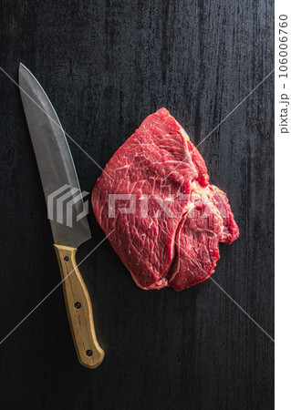Raw fillet steak beef meat on black table. Top view. Raw fillet steak beef meat on black table. Top view. 106006760