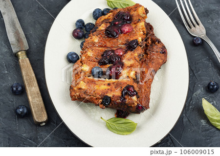Grilled pork ribs with berry sauce. 106009015