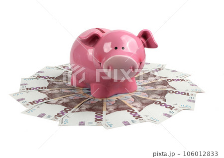 Circle of ukrainian money - thousand banknotes hryvnia with a piggy bank over it 106012833